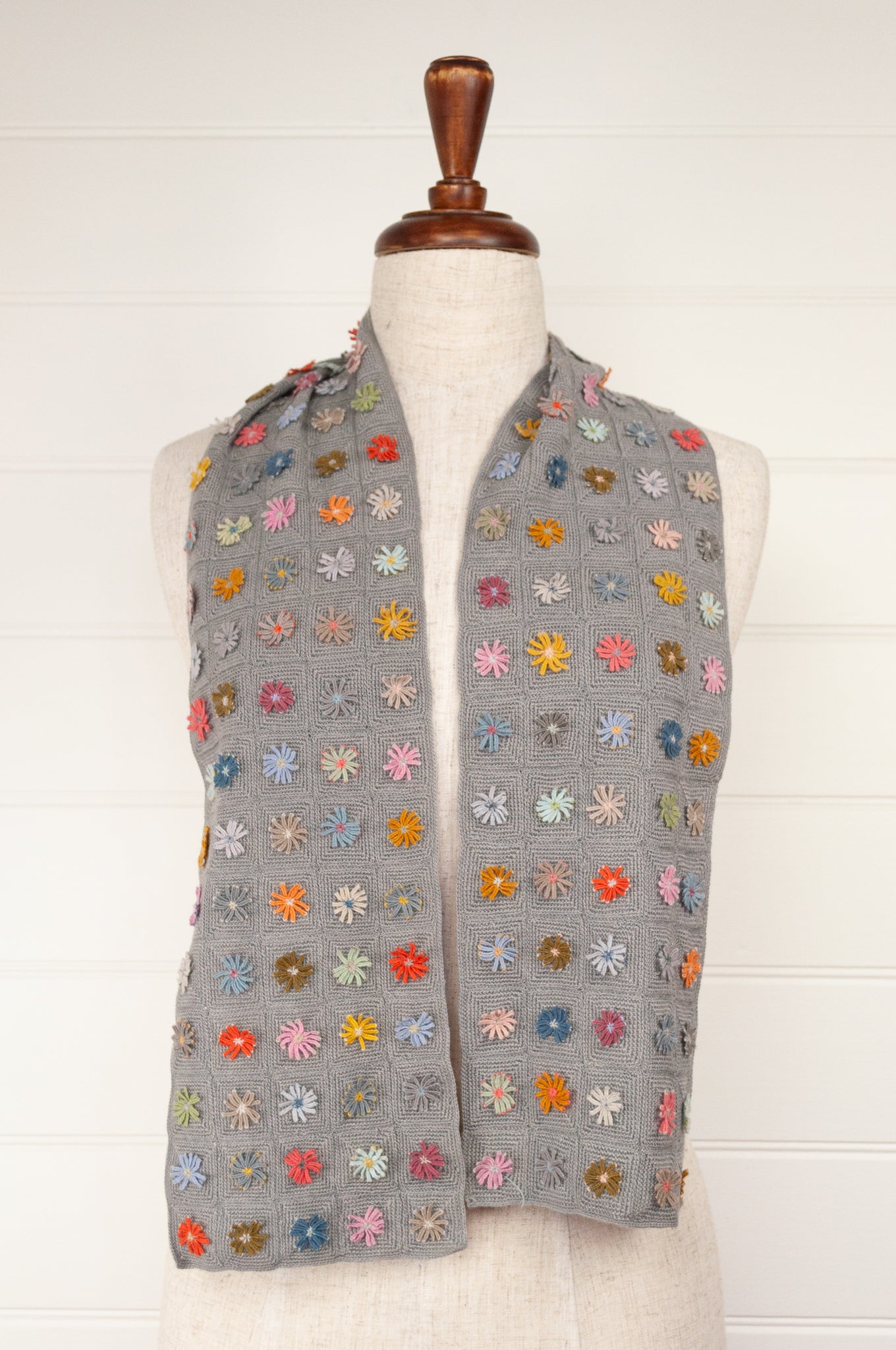 Sophie Digard medium size crochet scarf Ernestine multi colour flowers on a soft sage grey green checkboard base.