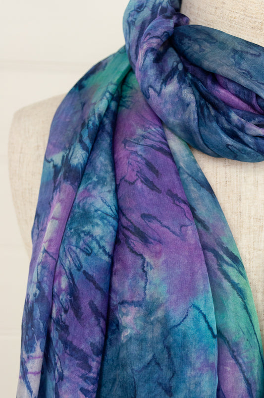 Digitally printed lightweight silk scarf in waterlily, shades of blue, mauve, lavender, aqua and teal.