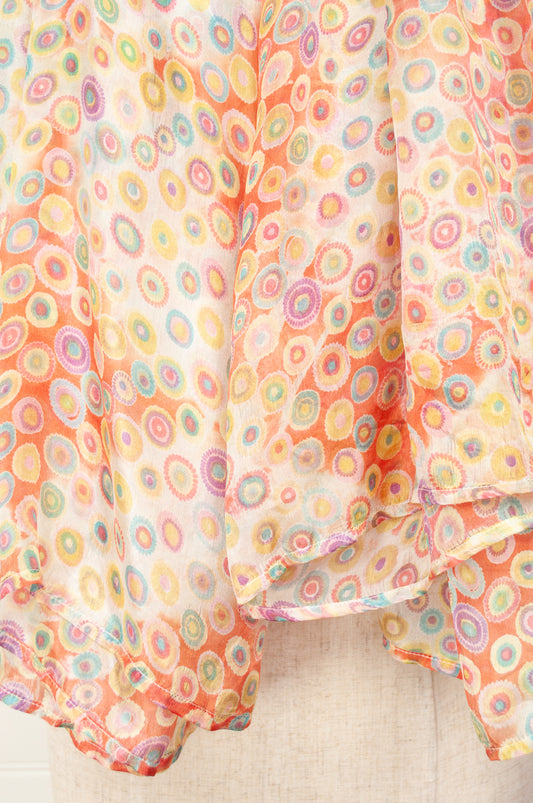 Juniper Hearth silk scarf, digital printed multi colour dots on white, with smudged diamond areas in coral red.