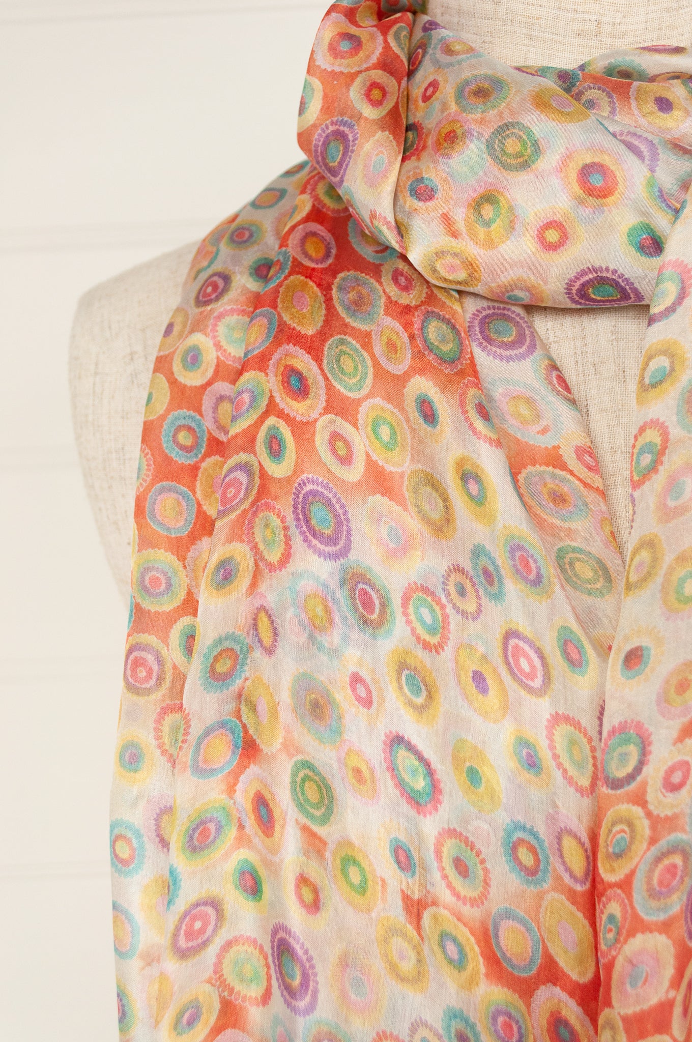 Juniper Hearth silk scarf, digital printed multi colour dots on white, with smudged diamond areas in coral red.
