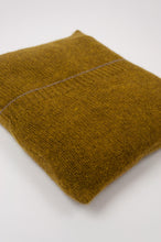 Load image into Gallery viewer, Juniper Hearth baby yak wool poncho in Weed, a deep yellow olive green shade (close up in pouch).