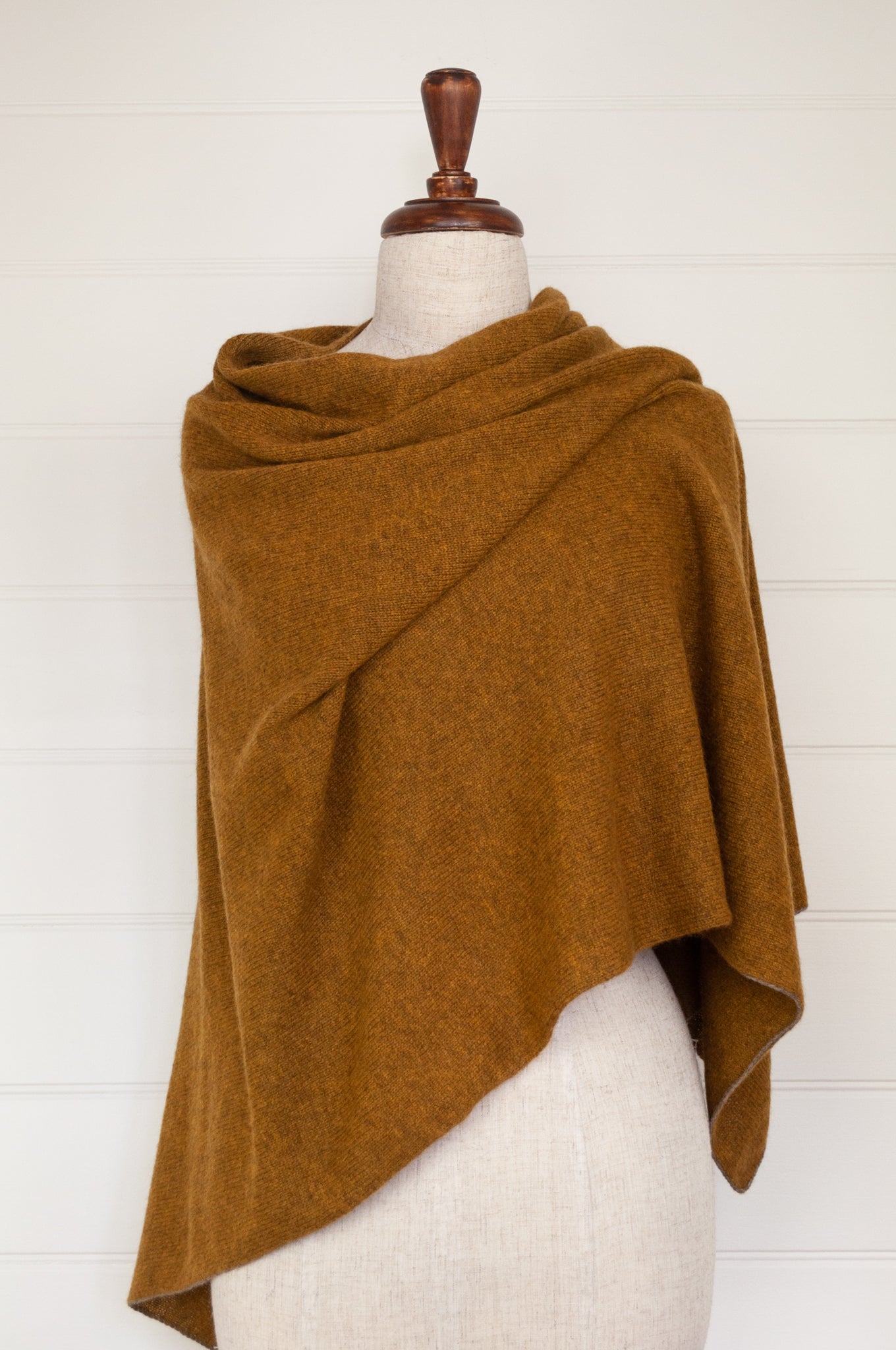 Juniper Hearth baby yak wool poncho in Maize, a deep mustard gold.