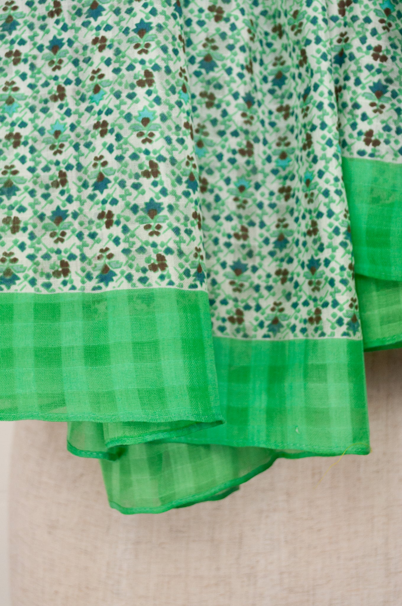 Anna Kaszer designed in Paris, made in India fine cotton dobby voile scarf, small all over floral with self check in green and white.