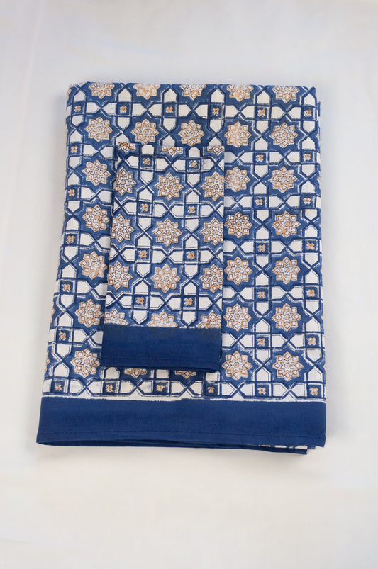 Blockprinted cotton table cloth, Almira Moroccan tile print in indigo denim blue and white with soft gold highlights.