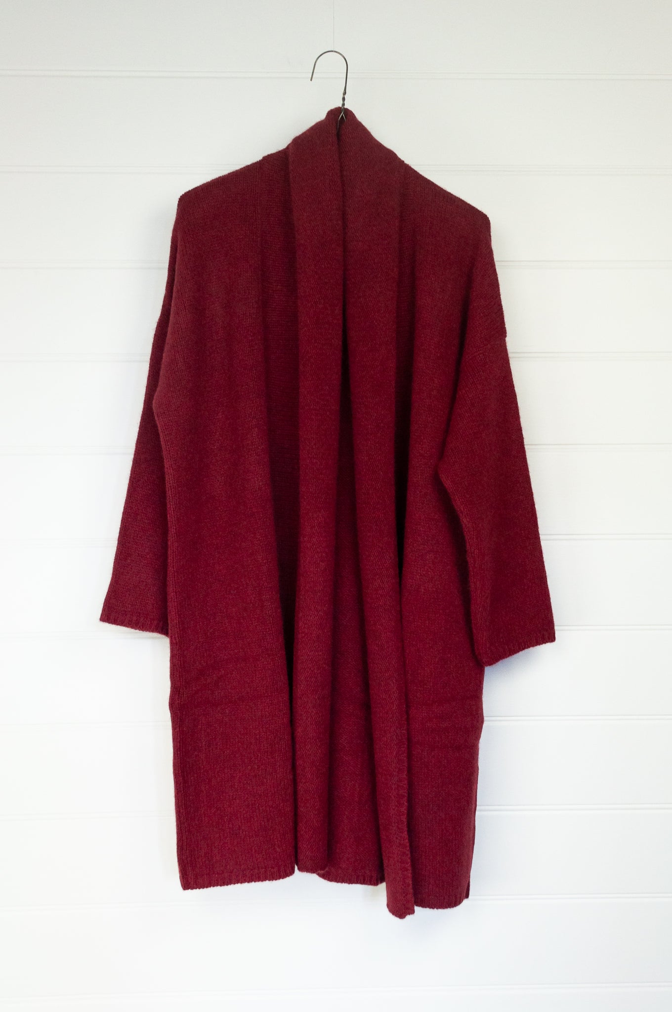 One size, longline boyfriend cardigan with shawl collar, in cherry red baby yak wool made in Nepal.