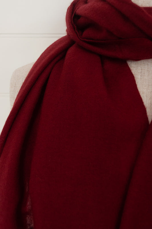 Juniper Hearth woven cashmere scarf featuring fagoting detail and fringed at ends, in cherry red.