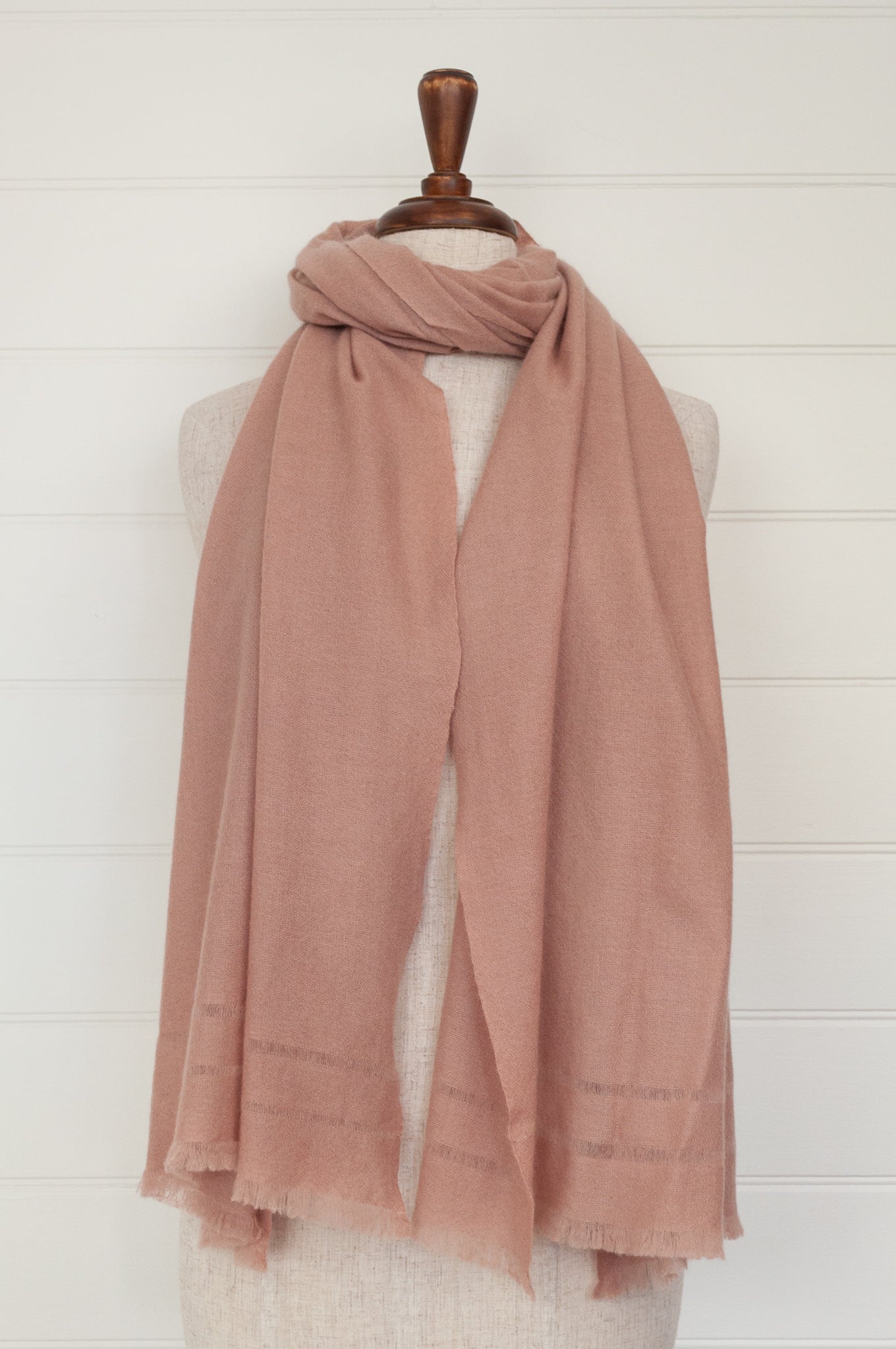 Juniper Hearth woven cashmere scarf featuring fagoting detail and fringed at ends, in vintage rose pink.