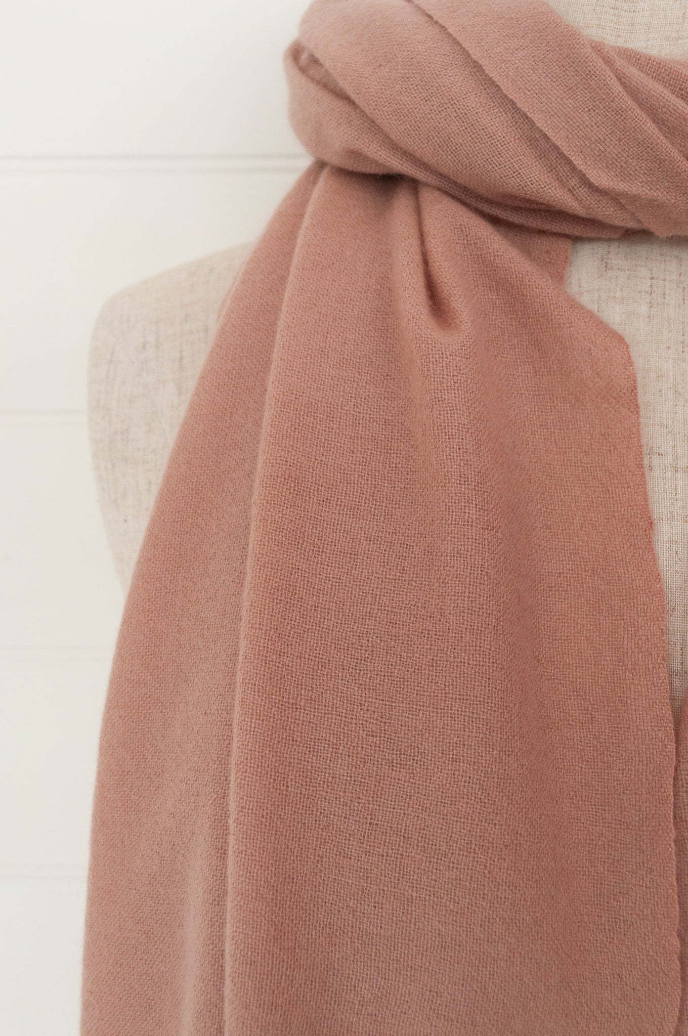 Juniper Hearth woven cashmere scarf featuring fagoting detail and fringed at ends, in vintage rose pink.