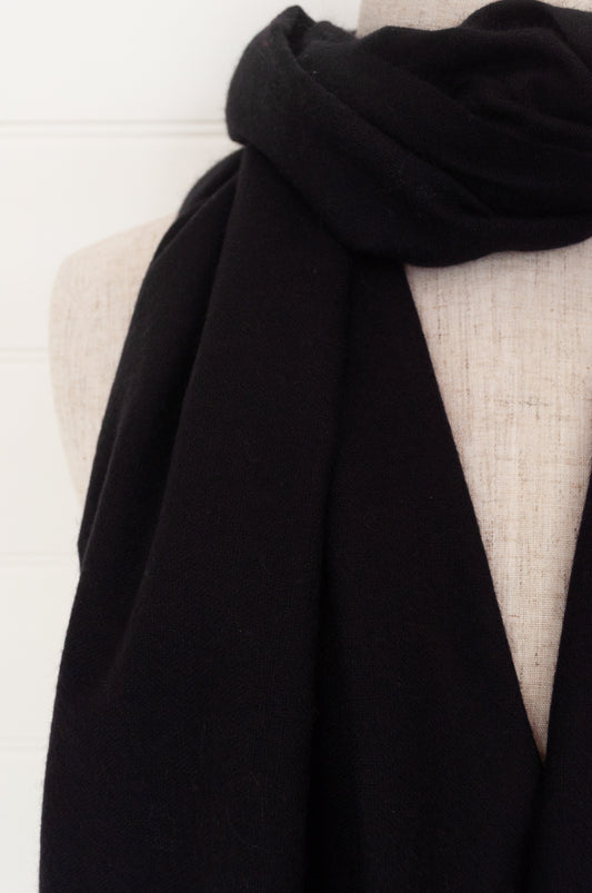 Juniper Hearth woven cashmere scarf featuring fagoting detail and fringed at ends, in black.