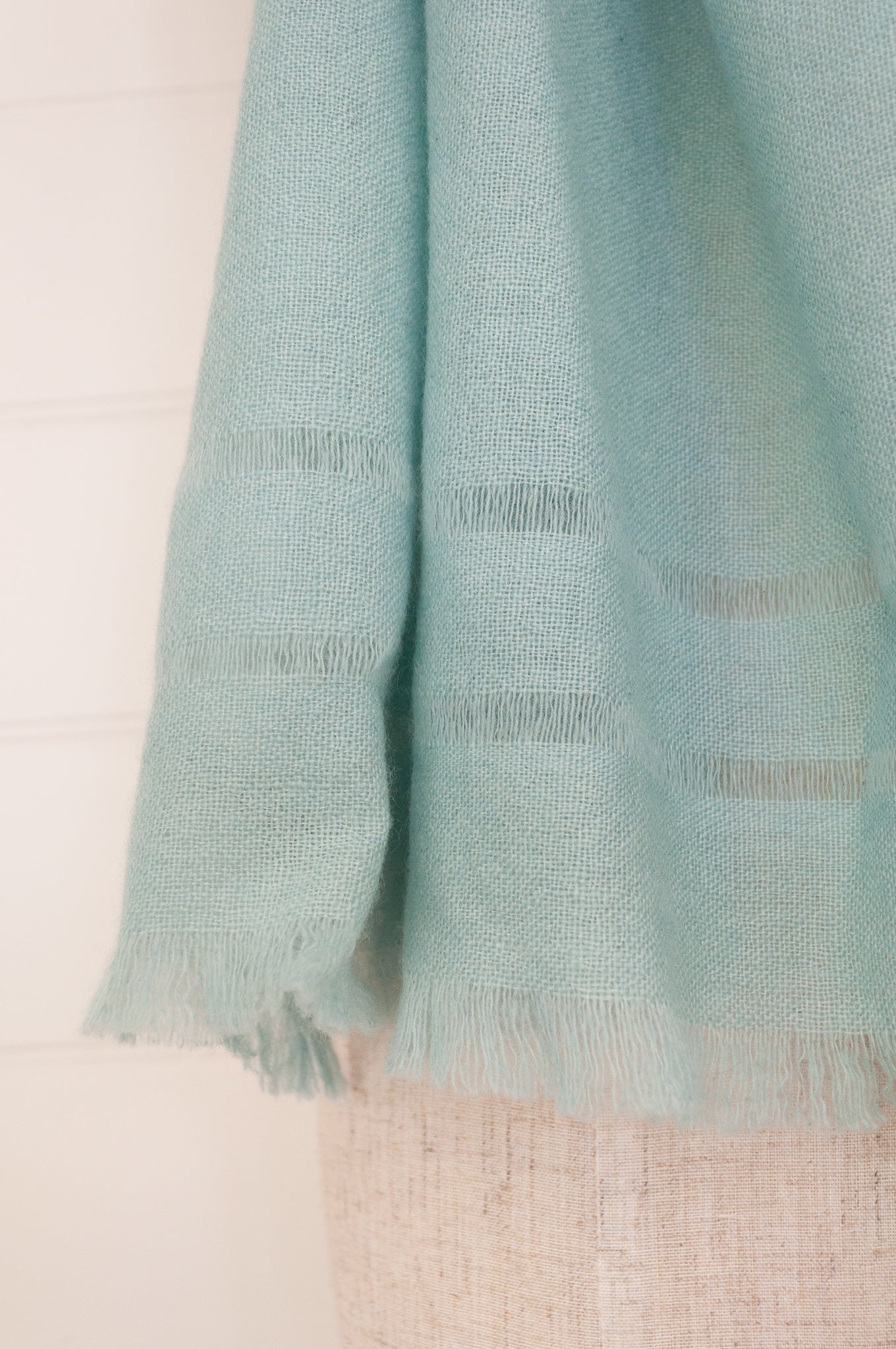 Juniper Hearth woven cashmere scarf featuring fagoting detail and fringed at ends, in soft duck egg blue..