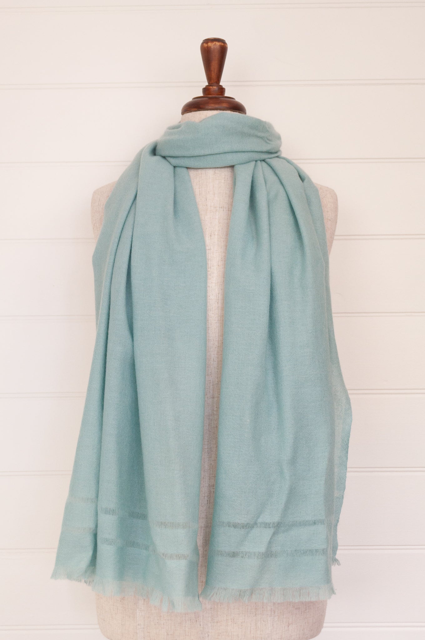 Juniper Hearth woven cashmere scarf featuring fagoting detail and fringed at ends, in soft duck egg blue..