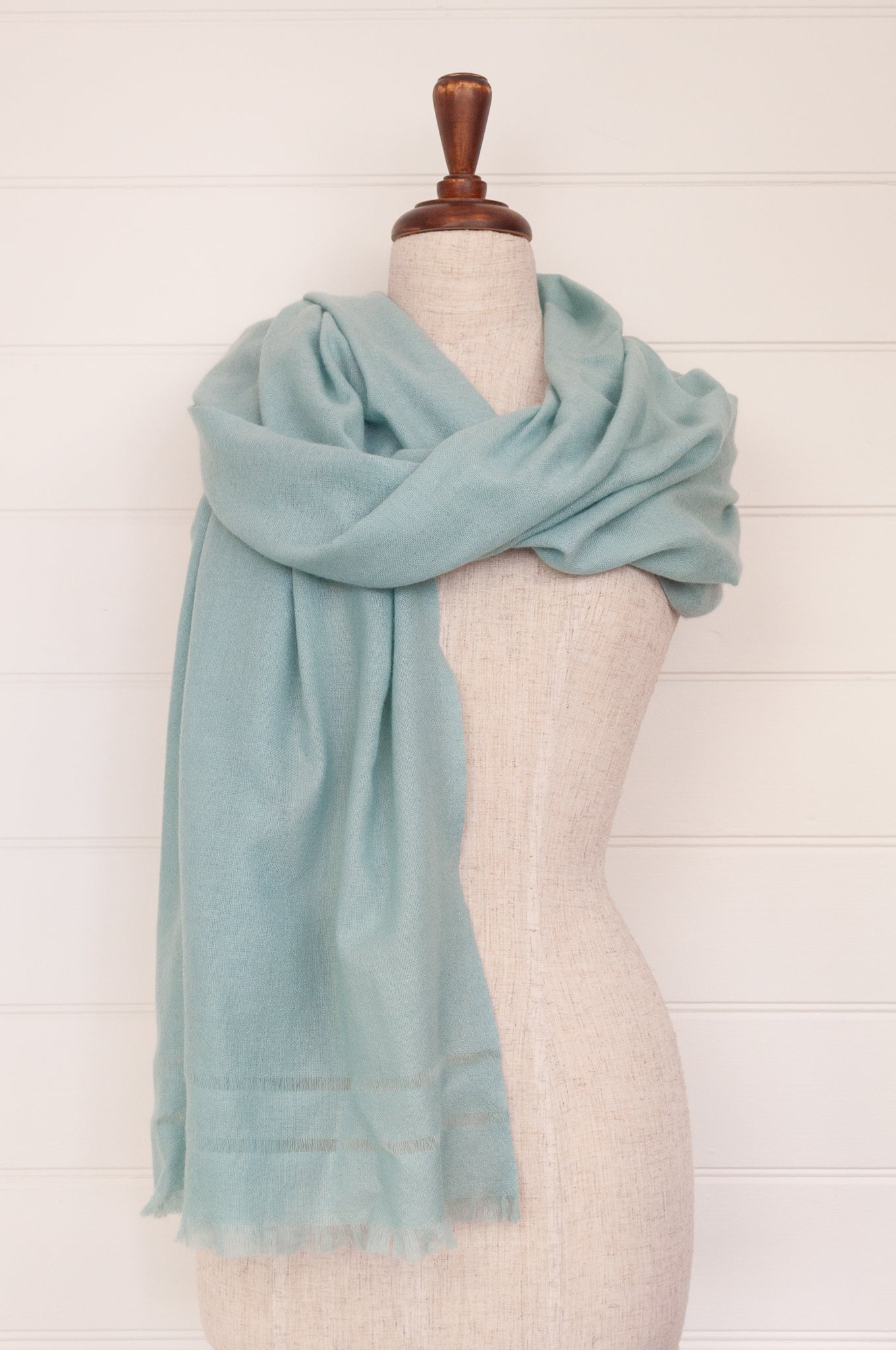 Juniper Hearth woven cashmere scarf featuring fagoting detail and fringed at ends, in soft duck egg blue..