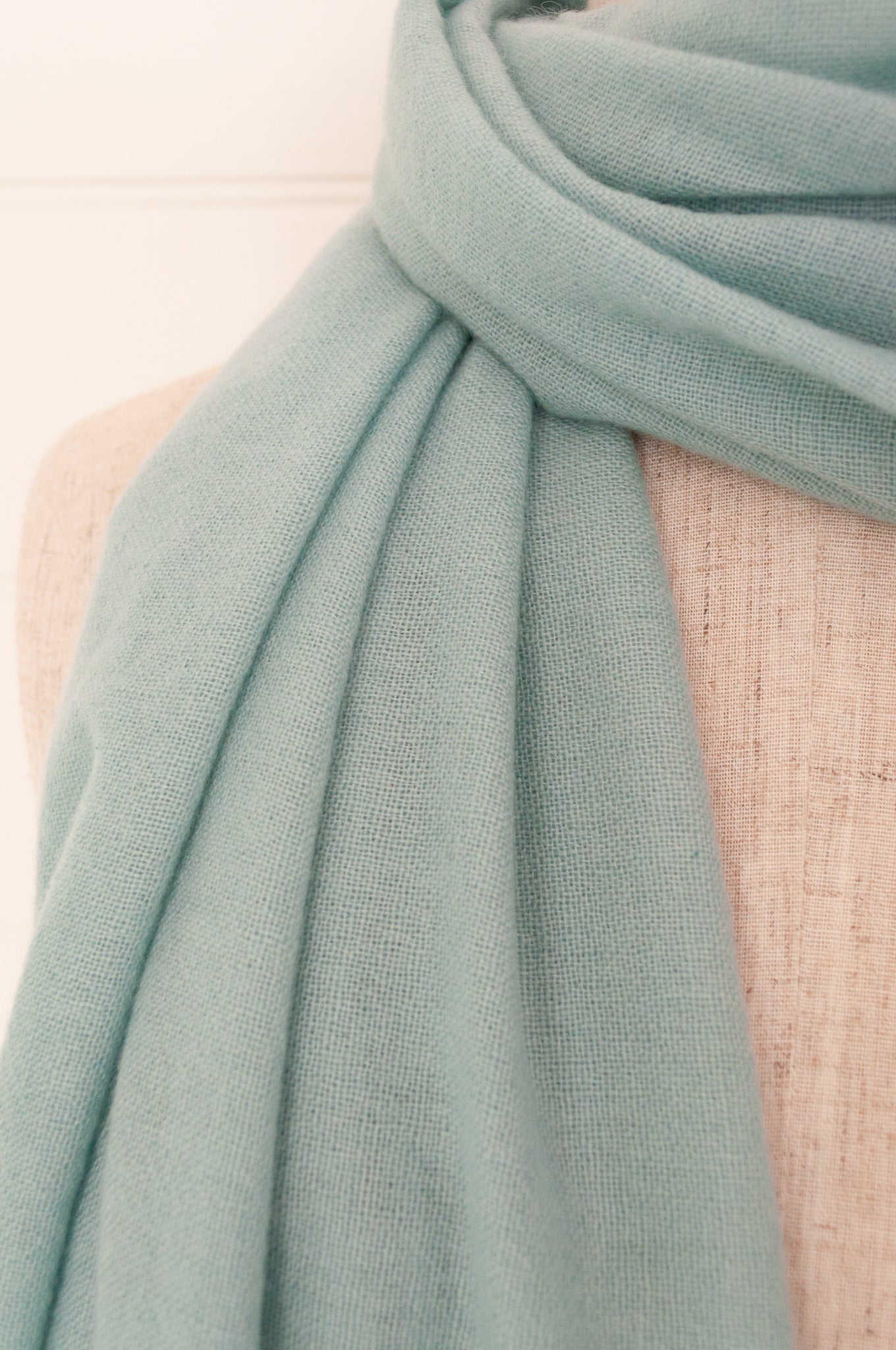 Juniper Hearth woven cashmere scarf featuring fagoting detail and fringed at ends, in soft duck egg blue..