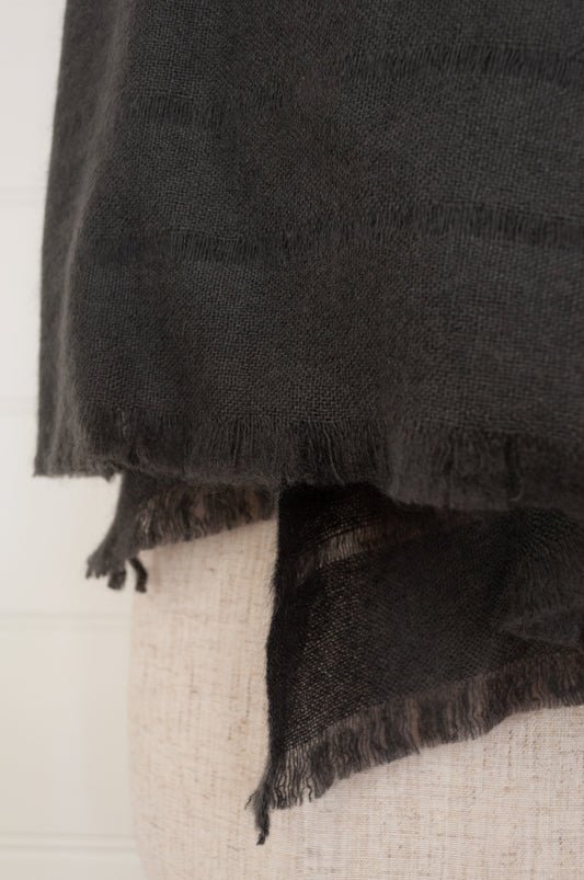 Juniper Hearth woven cashmere scarf featuring fagoting detail and fringed at ends, in charcoal.