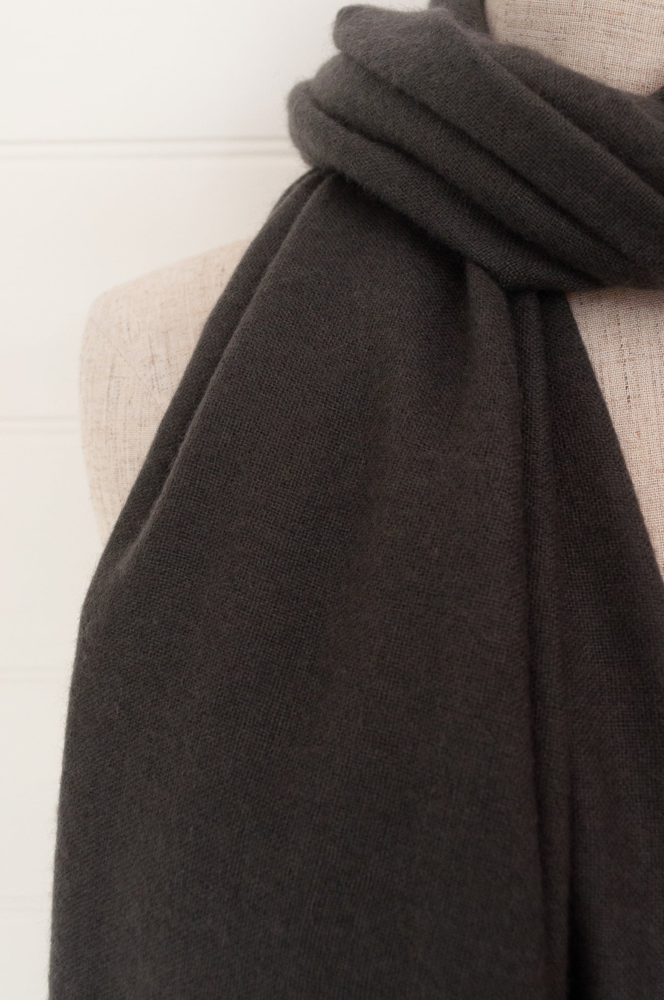 Juniper Hearth woven cashmere scarf featuring fagoting detail and fringed at ends, in charcoal.