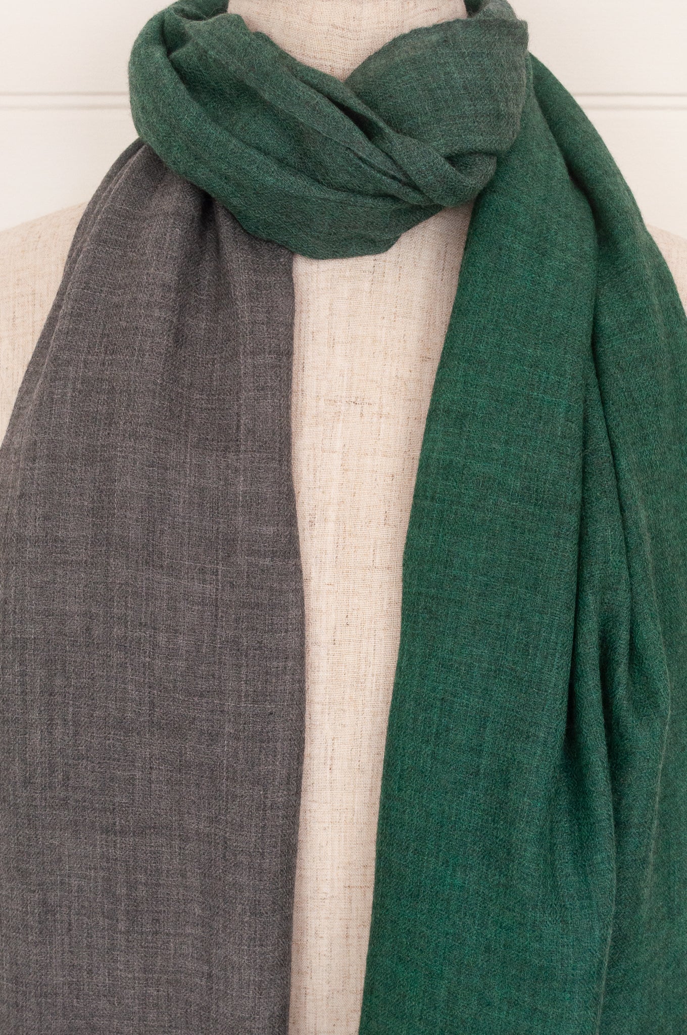 Juniper Hearth woven merino wool scarf, lightweight and very soft, melange dye from charcoal to jade green, with handmade pompoms.