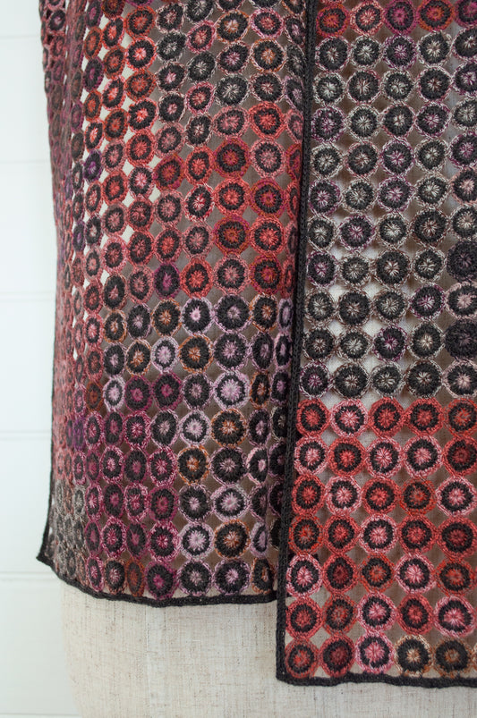 Sophie Digard crochet scarf Pigment in reds, pinks and browns.