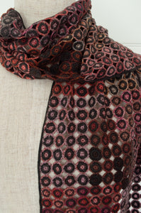 Sophie Digard crochet scarf Pigment in reds, pinks and browns.