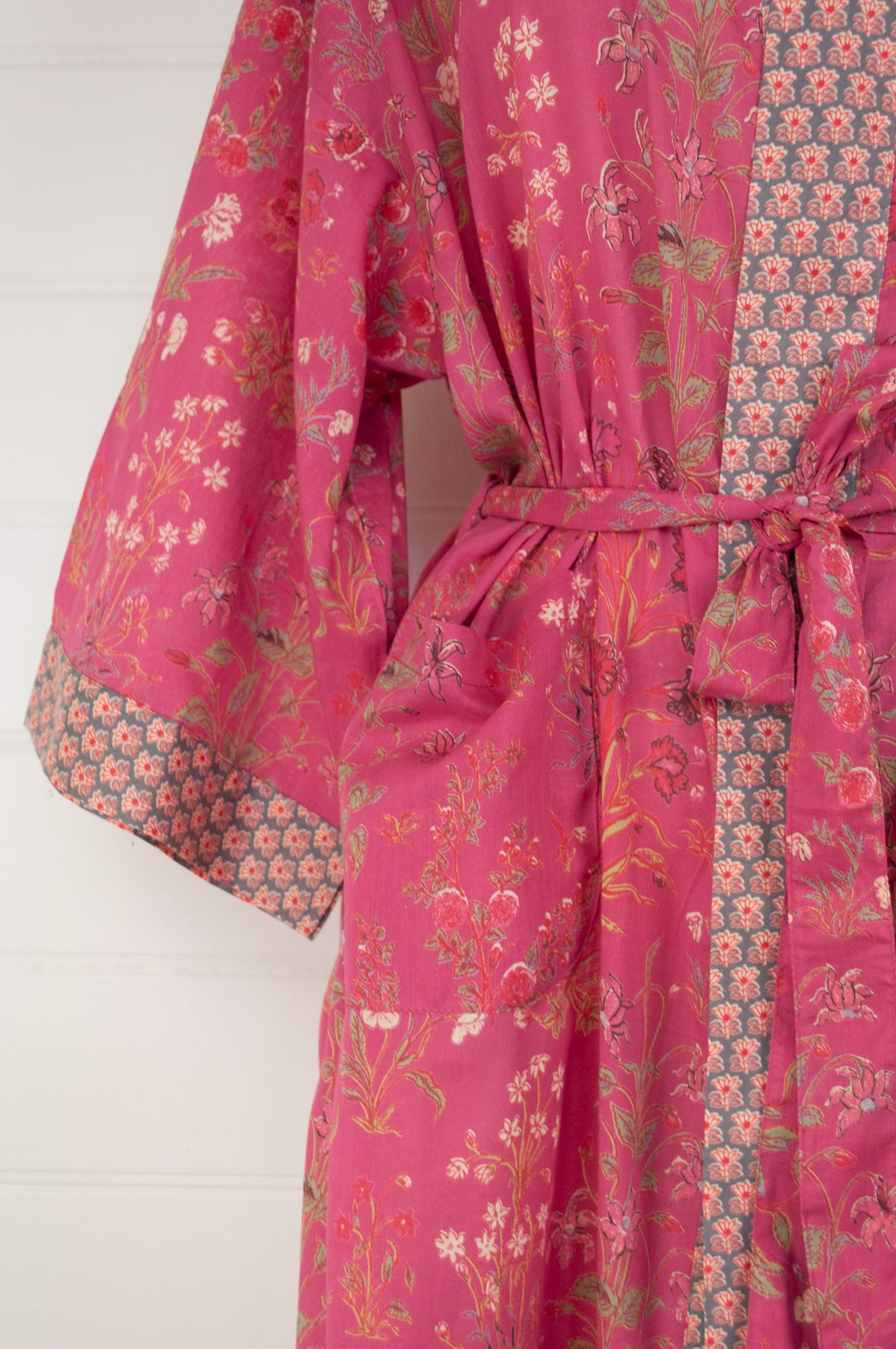 Ethically made, cotton voile kimono robe dressing gown in deep raspberry pink floral print.
