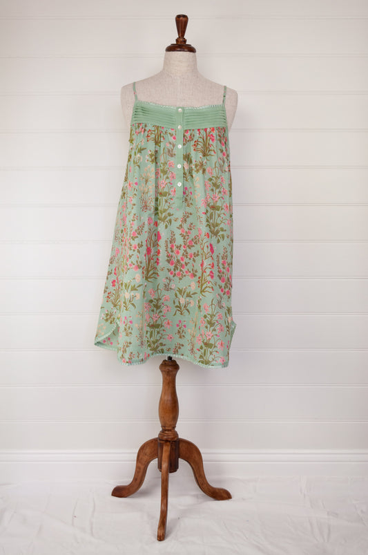Ethically made pure cotton voile summer nightdress with adjustable straps and pintucked yoke, this nightie is in a mint green floral print with broderie edging.