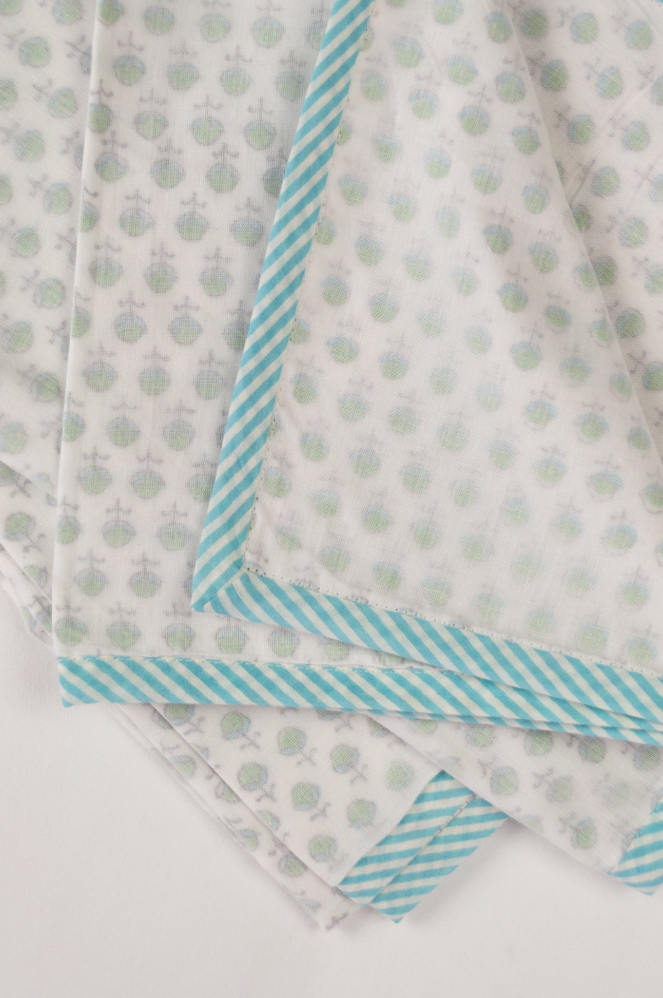 Baby dohar lightweight three layered baby wrap cot quilt, cotton muslin block printed, aqua and green sprig pattern.