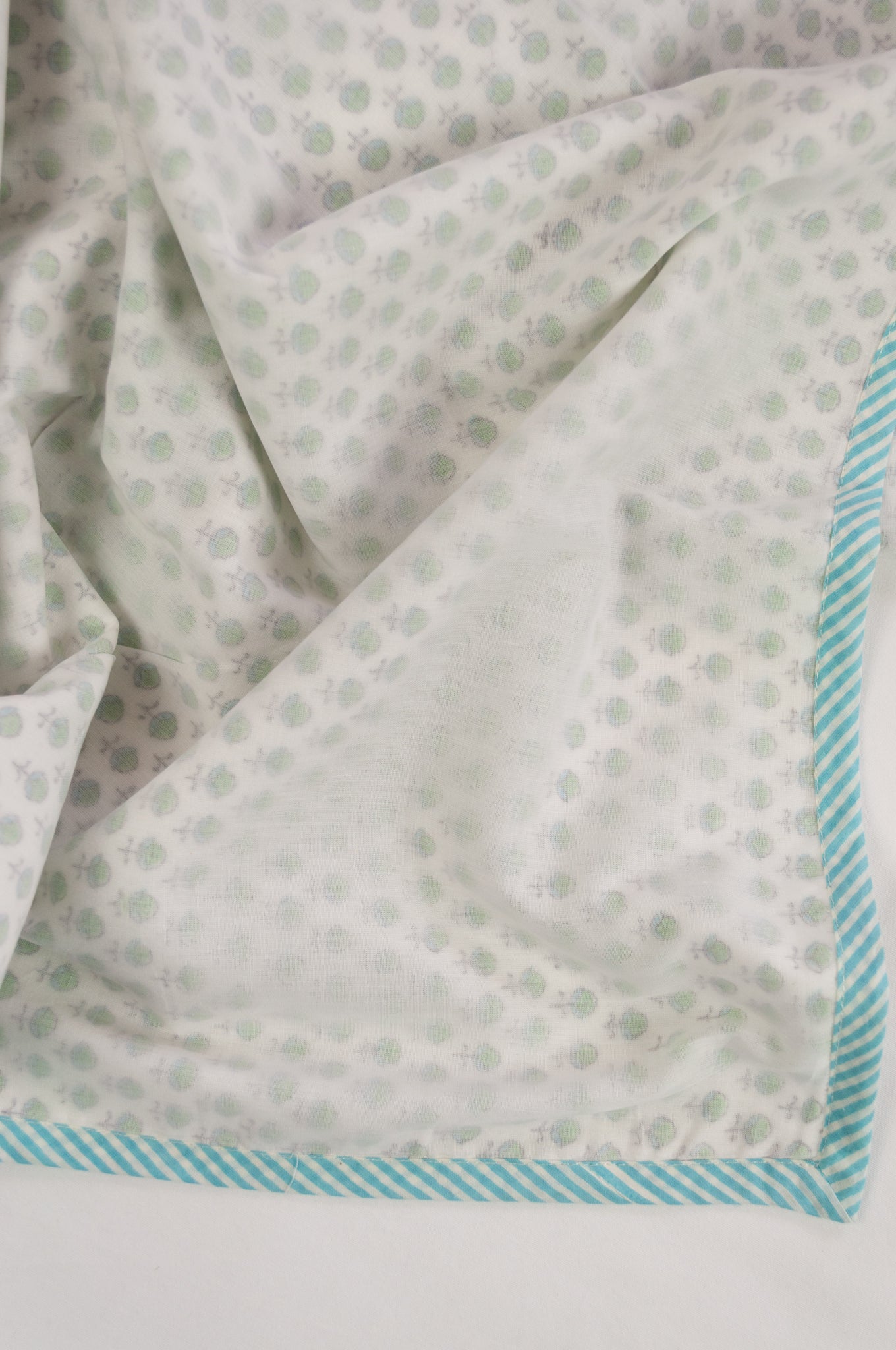Baby dohar lightweight three layered baby wrap cot quilt, cotton muslin block printed, aqua and green bud pattern.