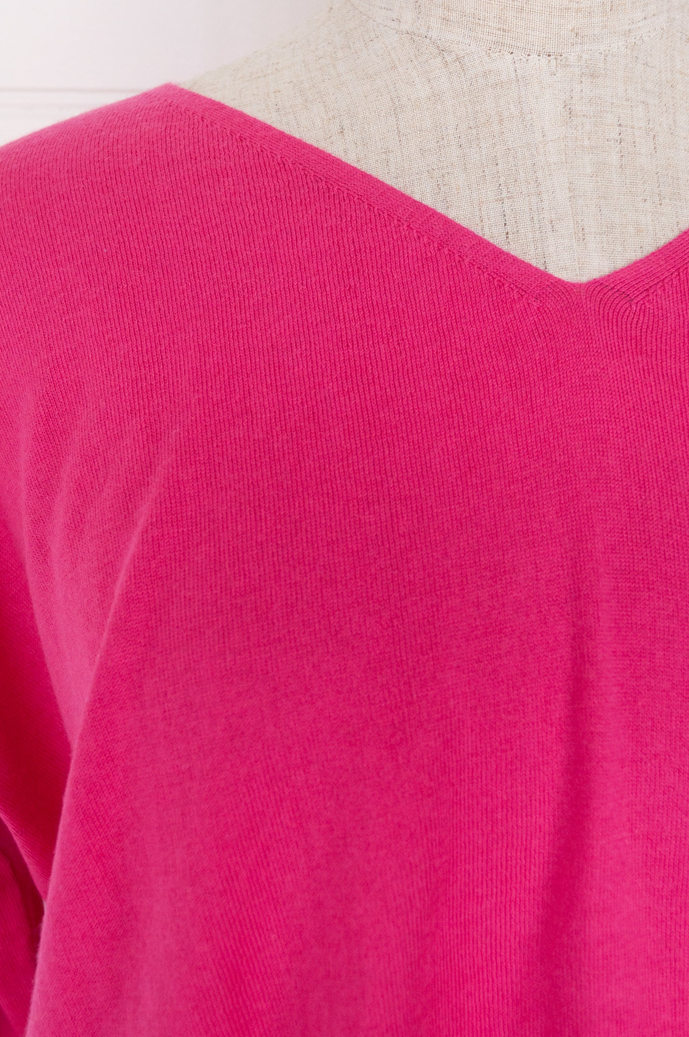 One size V-neck slouchy cashmere cotton summer sweater in bright rose pink.