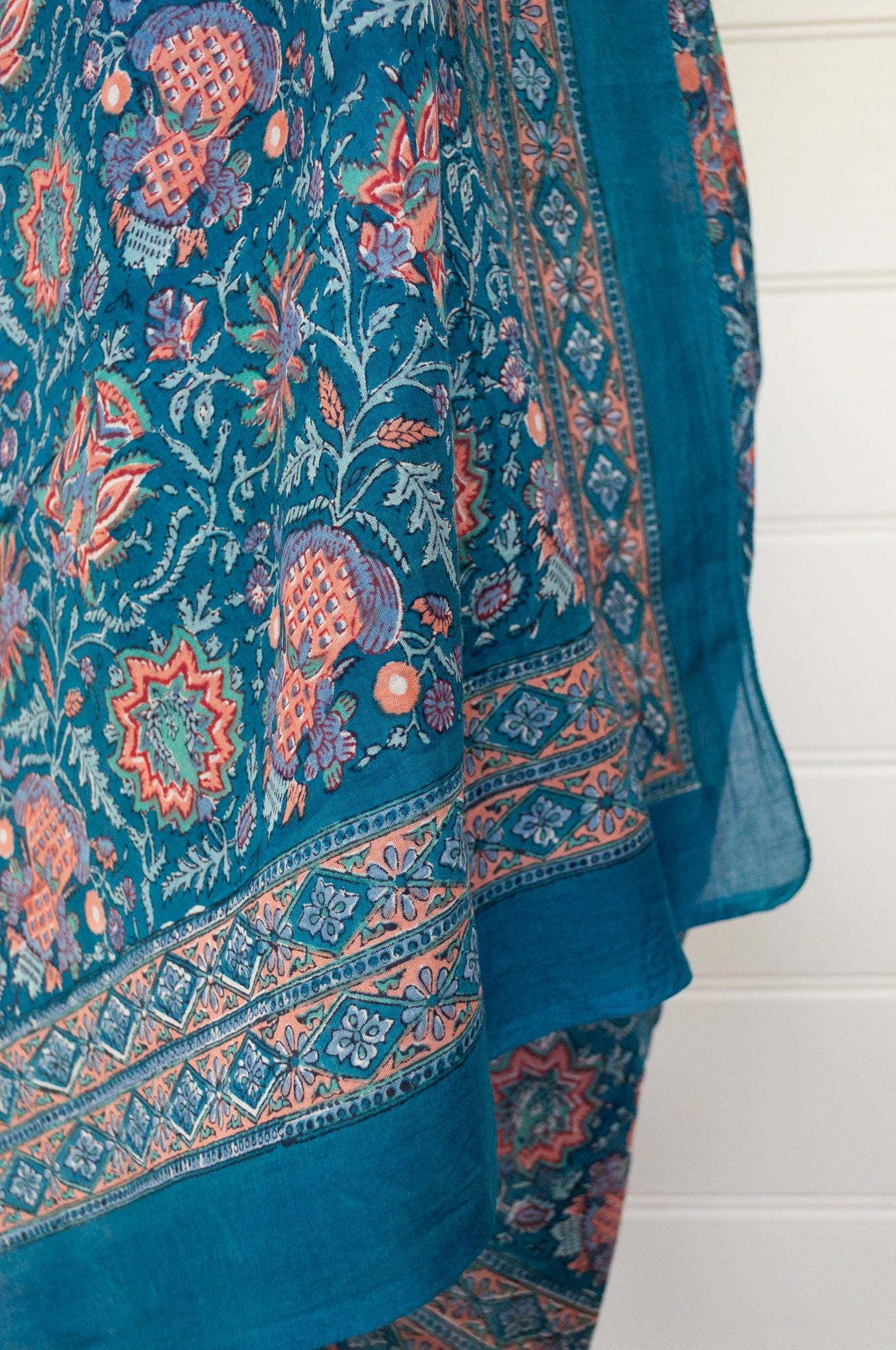 JH cotton voile sarong wrap scarf in teal floral with highlights in coral.