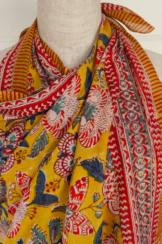 Cotton voile blockprint sarong, colourful floral on mustard yellow.