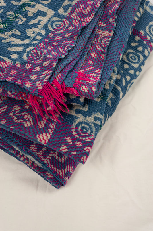 Vintage kantha quilt upcycled from cottonn saris, handstitched and overdyed with mud resist in natural indigo, and brilliant pink border stitching.