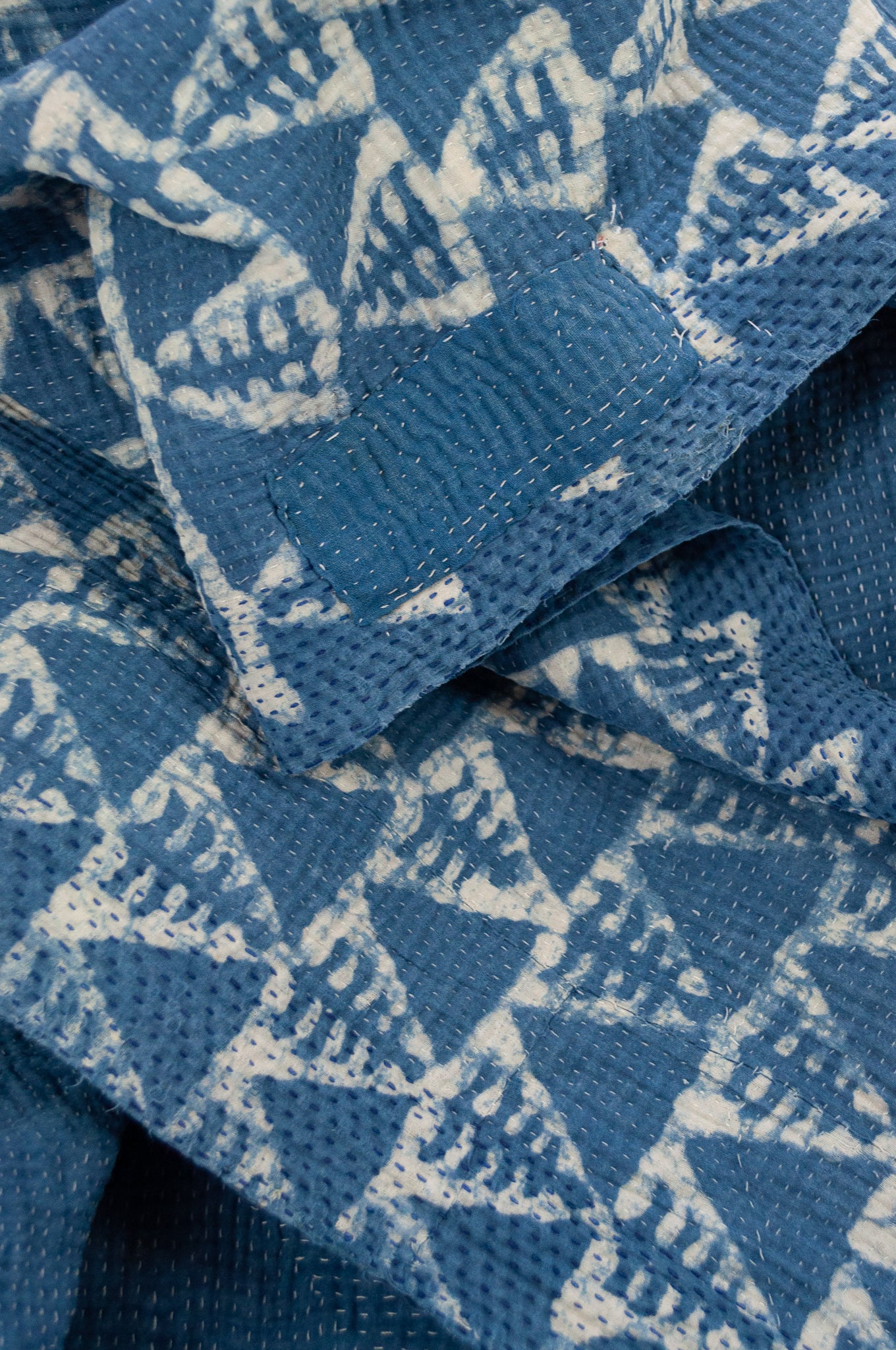 Vintage kantha quilt upcycled from cottonn saris, handstitched and overdyed with mud resist in natural indigo.