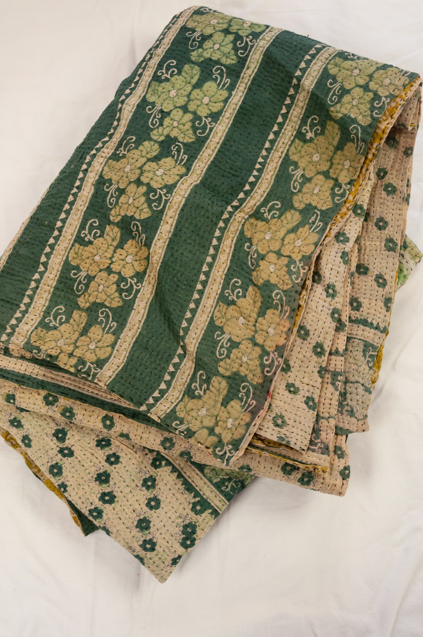 Vintage kantha quilt upcycled from cottonn saris, handstitched, in soft mustard yellow floral with magenta border, green and ecru floral on the reverse.