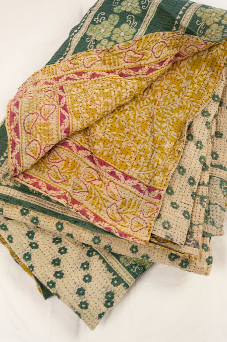 Vintage kantha quilt upcycled from cottonn saris, handstitched, in soft mustard yellow floral with magenta border, green and ecru floral on the reverse.