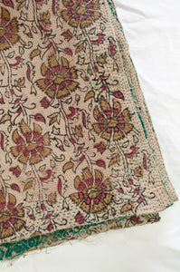 Vintage kantha quilt blockprinted in Bagru print, mustard and vintage red stylised floral print on taupebackground, reverse lantern print on taupe, with emerald green sari border.