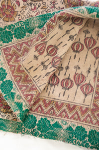Vintage kantha quilt blockprinted in Bagru print, mustard and vintage red stylised floral print on taupebackground, reverse lantern print on taupe, with emerald green sari border.