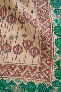 Vintage kantha quilt blockprinted in Bagru print, mustard and vintage red stylised floral print on taupebackground, reverse lantern print on taupe, with emerald green sari border..