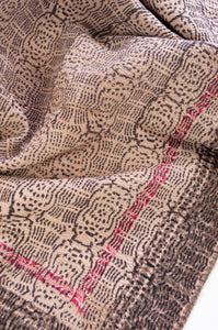 VIntage kantha quilt blockprinted in Bagru print, olive and mustard flowers on rust brown background, reverse black geometric on off white.