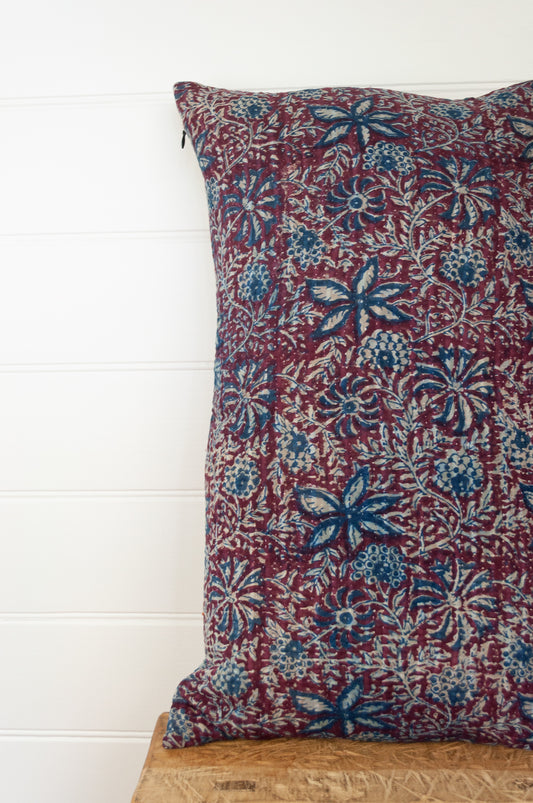 Vintage kantha oblong rectangular bolster cushion blockprinted with floral design in indigo and deep burgundy red.