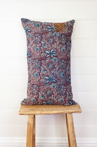 Vintage kantha oblong rectangular bolster cushion blockprinted with floral design in indigo and deep burgundy red.