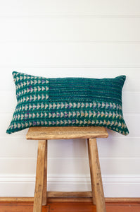 Vintage kantha oblong rectangular bolster cushion blockprinted with arrow and stripe design in deep blue green.