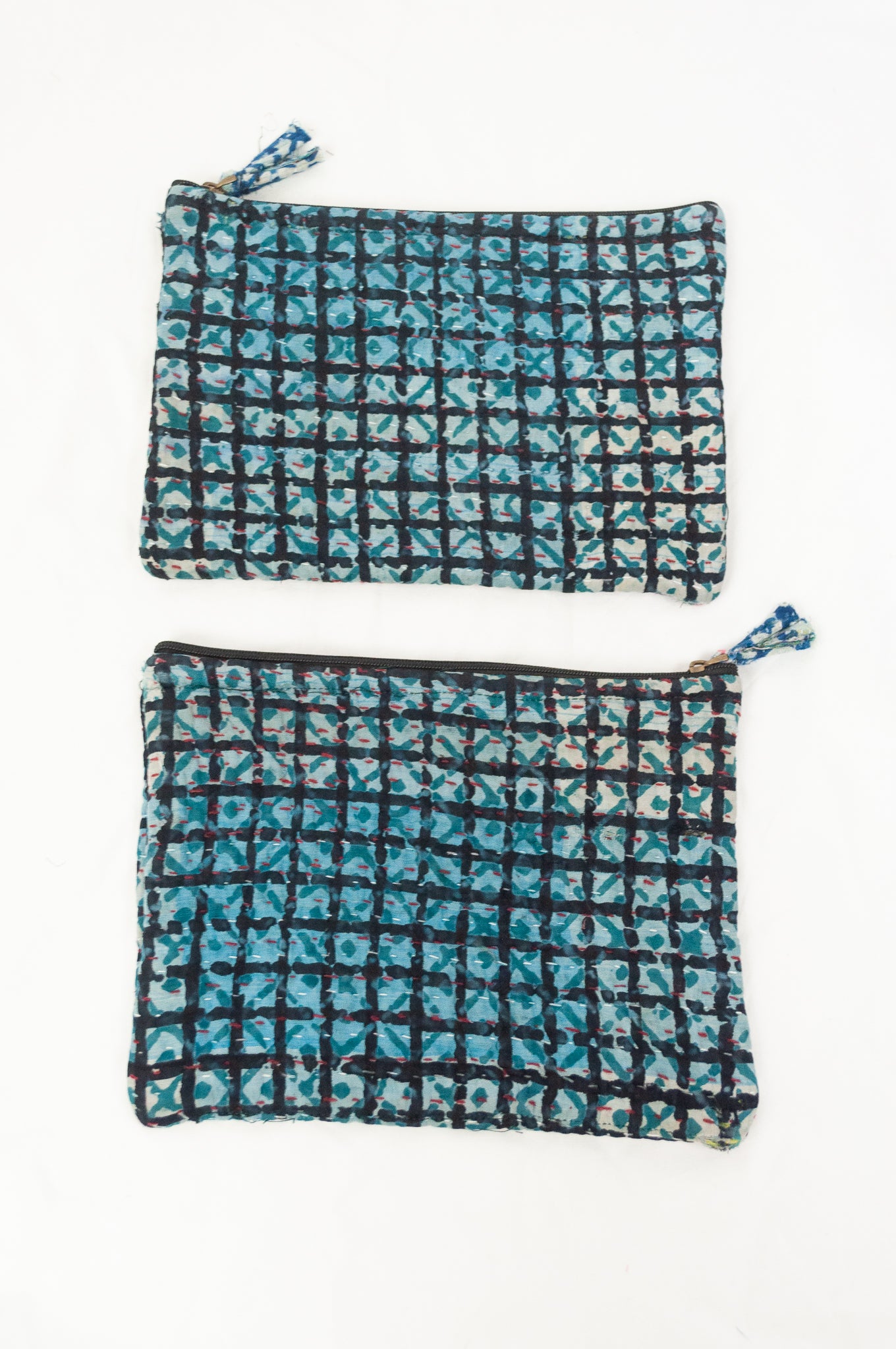 Zippered cotton pouches made from vintage kantha quilt remnants in blue, green and black blockprinted design.
