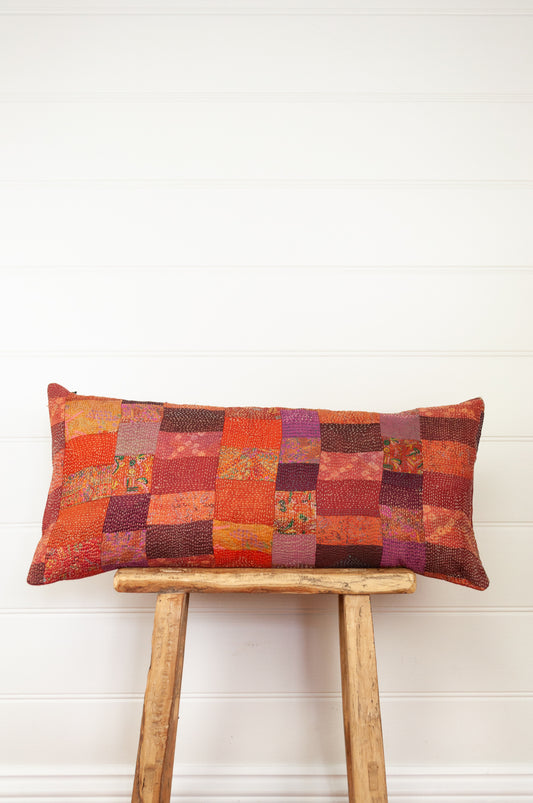 Vintage silk patchwork vibrant shades of russet orange, pink, burgundy.