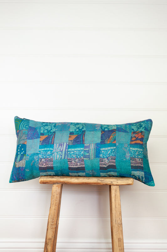 Vintage silk patchwork vibrant shades of azure blue with dashes of orange.