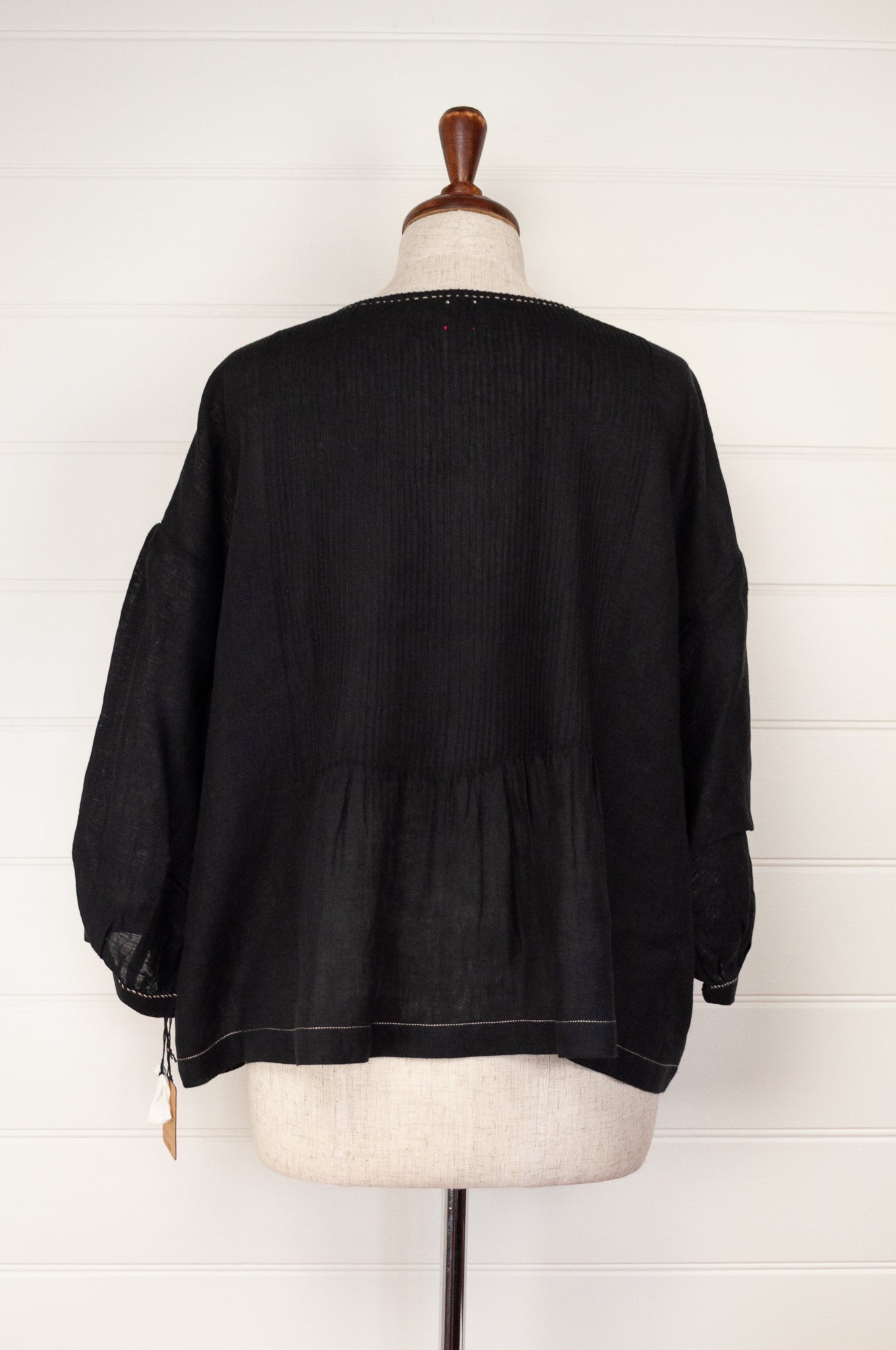 Dve Collection black linen Anisha top, one size, pintucked bodice, three quarter gathered sleeves, hand stitched details.