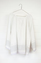 Load image into Gallery viewer, Juniper Hearth Yuka top in fine white cotton with self check, fine black stripe border with lavender highlight, gathered neck, loose fit one size long sleeve smock tunic top.