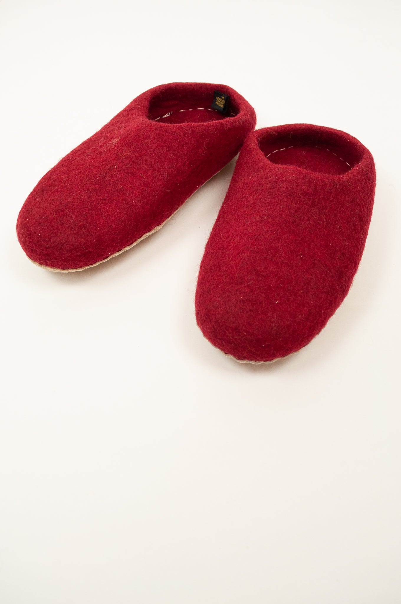 Crimson wool felt slippers, slip on style, fair trade and ethically made in Nepal.