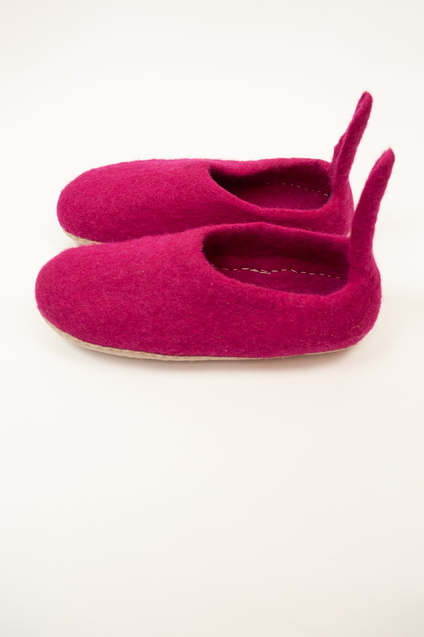 Fuchsia pink wool felt slippers, pull on style with tab, fair trade and ethically made in Nepal.