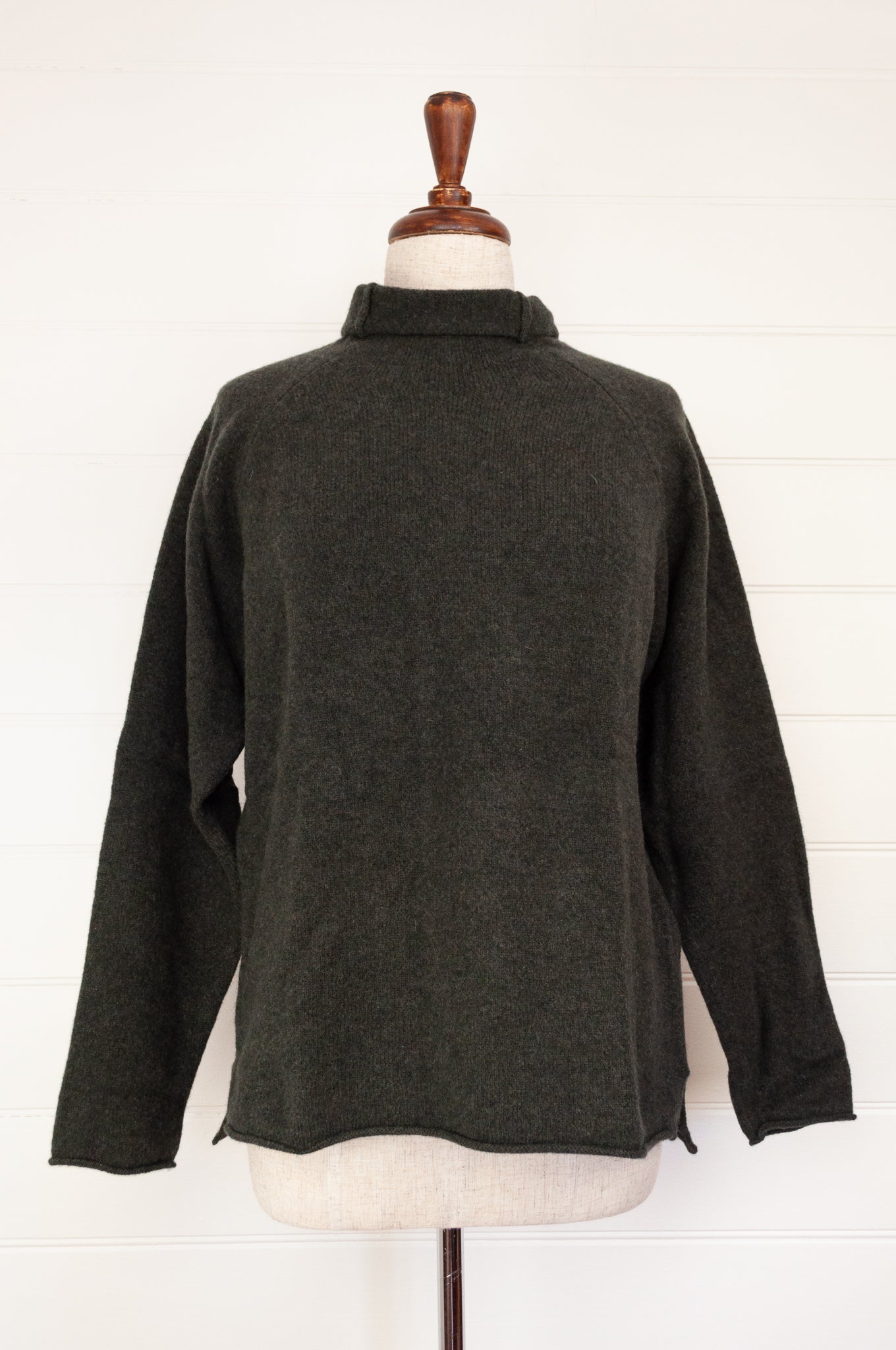 Eribe made in Scotland pure lambswool merino wool Corry raglan sweater, relaxed fit, roll neck, in Seaweed, deep olive green.