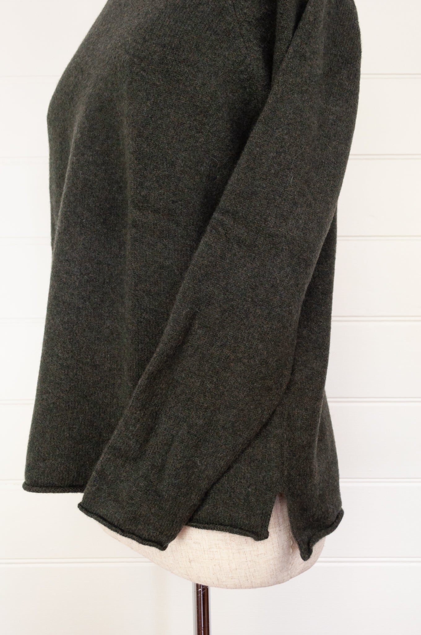 Eribe made in Scotland pure lambswool merino wool Corry raglan sweater, relaxed fit, roll neck, in Seaweed, deep olive green.