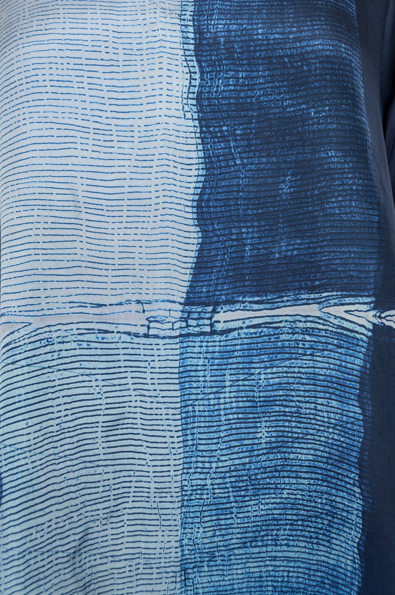 Pure silk shibori dyed silk kurta top in shades of indigo.